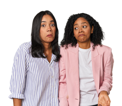 Young Latin businesswomen in studio shrugs shoulders and open eyes confused.