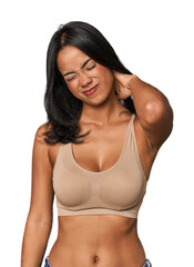Naklejka premium Young Filipino woman in light wear suffering neck pain due to sedentary lifestyle.
