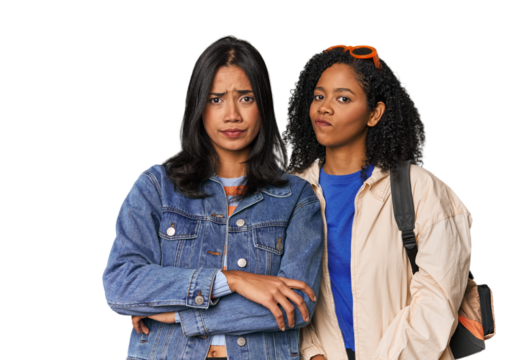 Latin friends ready for vacation unhappy looking in camera with sarcastic expression.