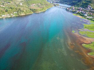 Aerial drone view of polluted river. The aftermath of excessive phosphate release to the river....