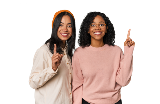 Young Latin friends together in studio showing number one with finger.