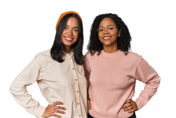 Young Latin friends together in studio confident keeping hands on hips.