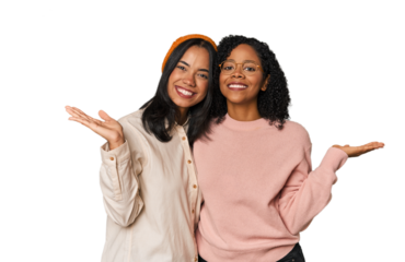 Young Latin friends together in studio makes scale with arms, feels happy and confident.