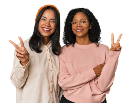 Young Latin friends together in studio showing number two with fingers.