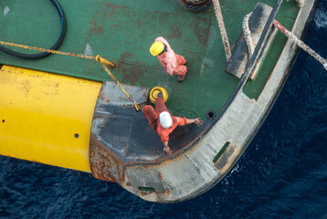 Aerial shot top down view of two crews cargo boat waiting for loading