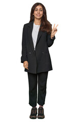 Middle Eastern in business attire showing number two with fingers.