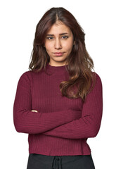 Fototapeta premium Middle Eastern woman in studio unhappy looking in camera with sarcastic expression.