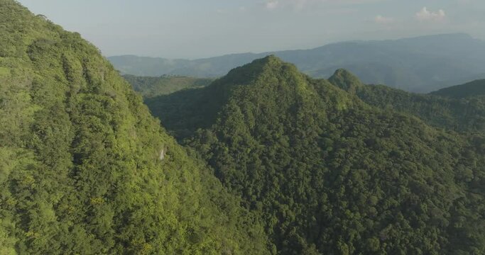 Aerial view of lush green mountains and serene valley, Mesetas, Meta, Colombia.