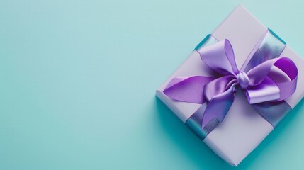 A gift box adorned with a purple ribbon on a pastel background, viewed from above.