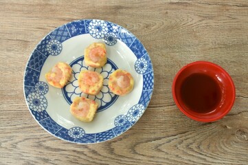 steamed chicken tendon with mashed pork topping shrimp or dim sum on plate dipping sour soy sauce  
