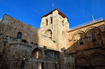 Historic Church of the Holy Sepulchre in Jerusalem under clear blue sky