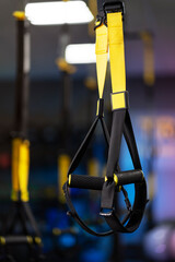 Trx straps in urban modern gym. Fitness equipment, healthy lifestyle