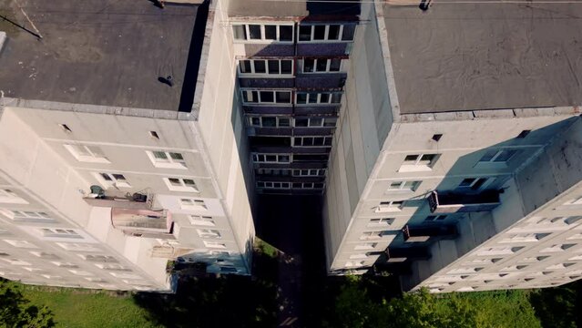 Top down view and descend on communistic soviet architecture getto building