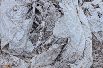 gray white dirty plastic texture of a piece of crumpled cellophane