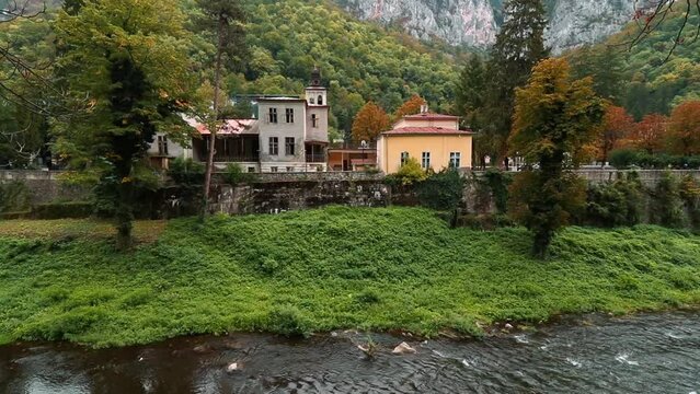River Cerna with Vila Elizabeta, and Cerna Mountains in the background in Baile Herculane, Romania
