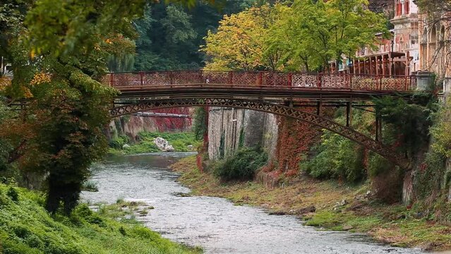 Podul de Fonta (the Cast Iron Bridge) on River Cerna on a cloudy day in Baile Herculane, Romania