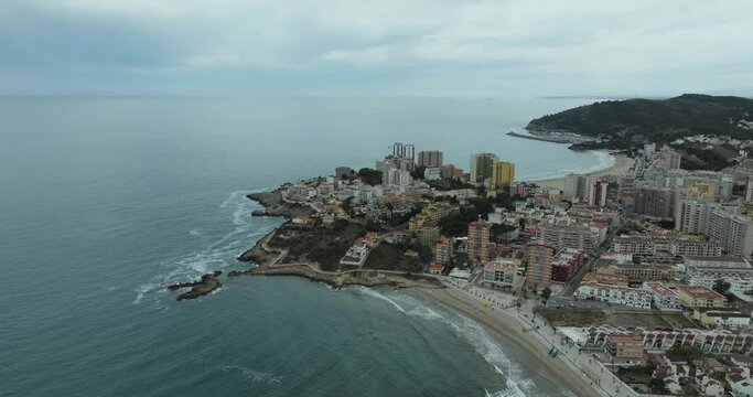 Aerial view of coastal town with Mediterranean beach and buildings, Oropesa del Mar, Spain.