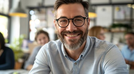 Fototapeta premium Diverse Business Meeting with Smiling Bearded Male Professional in Modern Office Setting