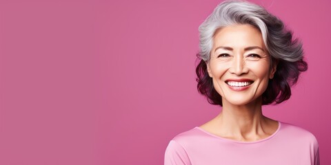 Obraz na płótnie Canvas Magenta Background Happy Asian Woman Portrait of Beautiful Older Mid Aged Mature Smiling Woman good mood Isolated Anti-aging Skin Care Face Beauty Product Banner with copyspace