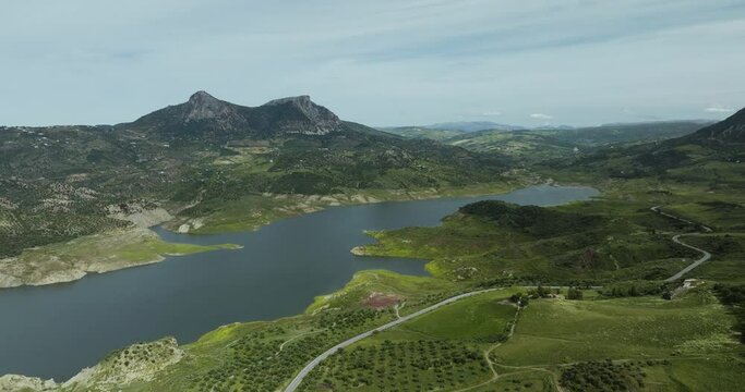 Aerial view of mountain forms and peak patterns over Embalse de Guadalteba, Campillos, Malaga, Spain.