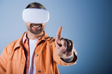 A man in a VR headset stands with a blindfold pointing directly at the camera, embodying a unique...