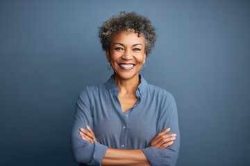 Navy Background Happy black american independant powerful Woman. Portrait of older mid aged person beautiful Smiling girl Isolated on Background ethnic diversity 