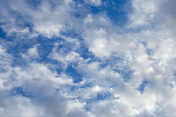 Bright sky texture background with white clouds, pleasing to the eye.