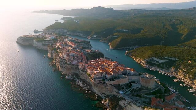 Aerial drone view of Bonifacio during sunset, Mediterranean coastal town in summer, island of Corsica, France