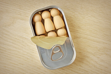 Wooden pawns in small sardines can - Concept of homologation and social conditioning