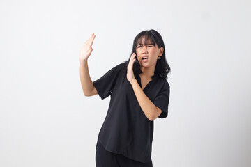 Portrait of attractive Asian woman forming a hand gesture to avoid something. Advertising concept....
