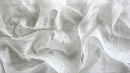 Fototapeta premium Close-up view of a white, sheer fabric with a delicate, wavy texture