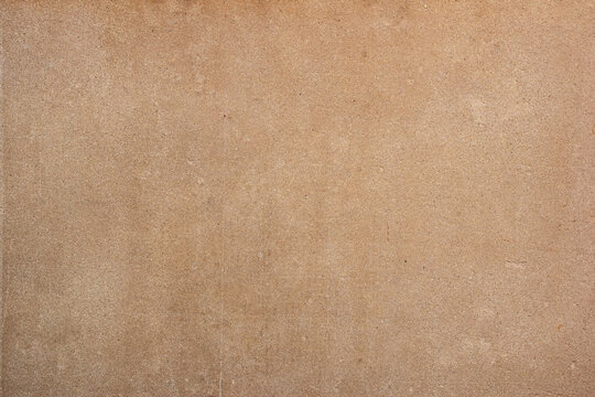 Pressed beige chipboard texture. Wooden background wallpaper. Chipboard background