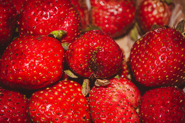 red ripe strawberry fruit background, contains vitamin c, close up, can be used in juice, ice cream and cake preparations