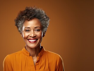Tan Background Happy black american independant powerful Woman. Portrait of older mid aged person beautiful Smiling girl Isolated on Background ethnic diversity 