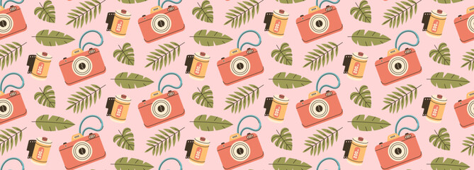 Camera and camera roll pattern. Travel stuff with tropical leaves background