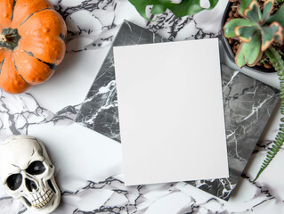 Flatlay of Halloween blank white paper greeting card menu invitation rsvp POD mock up pumpkin skull marble backdrop for natural earthy boho spook fall background empty cardstock note invite above view
