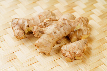 Fresh young turmeric on monochrome background