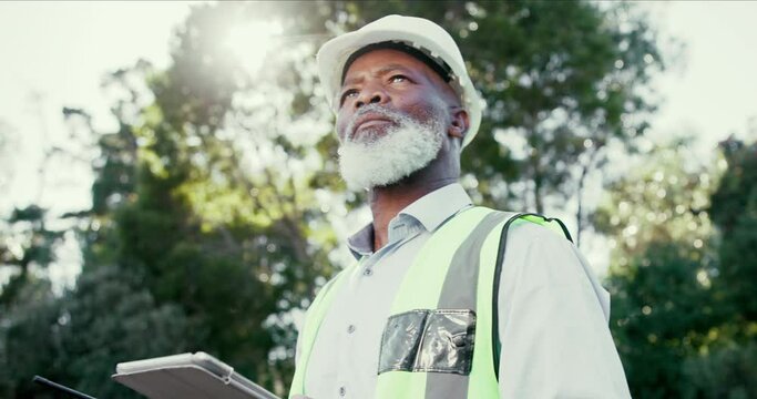 Radio, thinking and architect in construction, helmet and contractor in site, outdoor and excavation. Thoughtful, mature black man and person with tablet in maintenance, inspection or transceiver