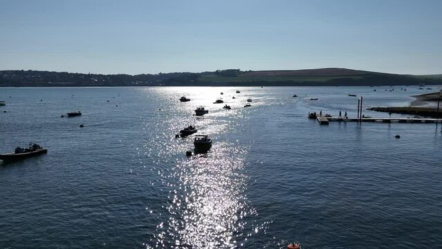 4k aerial of rock cornwall with boats showing estuary