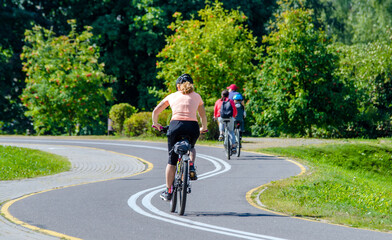 Fototapeta premium Cyclist ride on the bike path in the city Park 