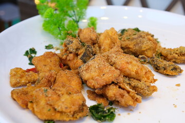 Deep fried fish served with vegetable. Fried shrimp with green chili sauce
