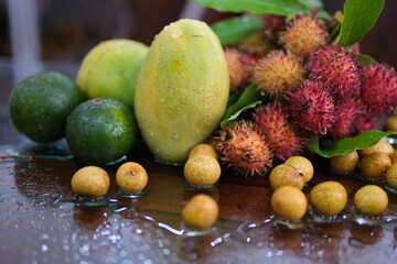 Many different delicious exotic fruits as background, top view
