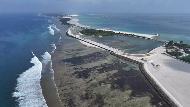 Aerial view of coastal development and road construction on Maradhoo Island, Addu Atoll, Maldives.