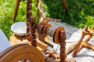 A spinning wheel on which flax fibres are spun into threads