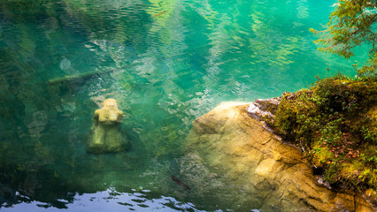 Blausee - one of the most beautiful lake in Europe, located in Switzerland, canton Berne. famous with emerald clear and trasparent waters , surrounded by Alps mountains . Popular tourist destination