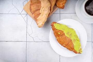 Set of colorful trendy flat croissants with different topping and fillings. Flat vanilla,...
