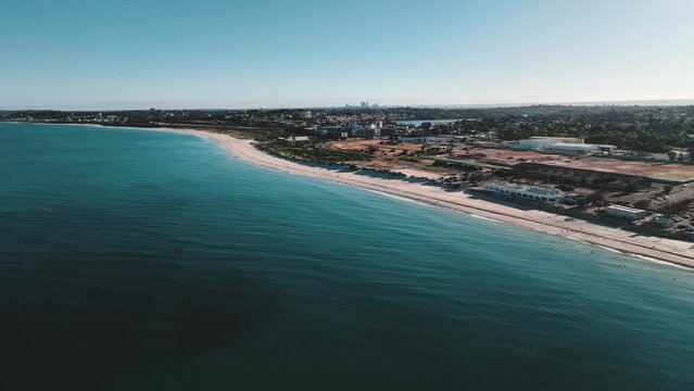 Aerial view of serene beach and coastal city skyline, Port Beach, Fremantle, Australia.