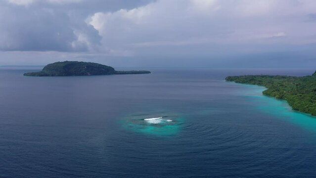 Drone top video of emerald reef in turquoise sea. Soothing ocean landscape. Sanma, Vanuatu. Tourism.