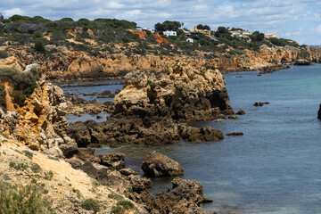 Rocky seashore. View of Praia da Vigia and Praia dos Arrifes beach in Albufeira, Algarve, Portugal,...