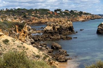 Rocky seashore. View of Praia da Vigia and Praia dos Arrifes beach in Albufeira, Algarve, Portugal,...